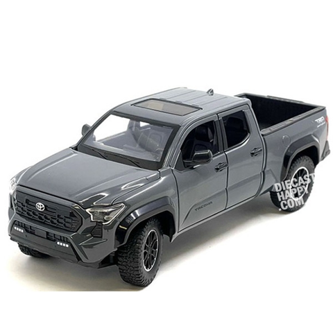 A 1:24 scale diecast model of a 2024 Toyota Tacoma TRD Pro Off-Road pickup truck in gray color, displayed without the packaging.